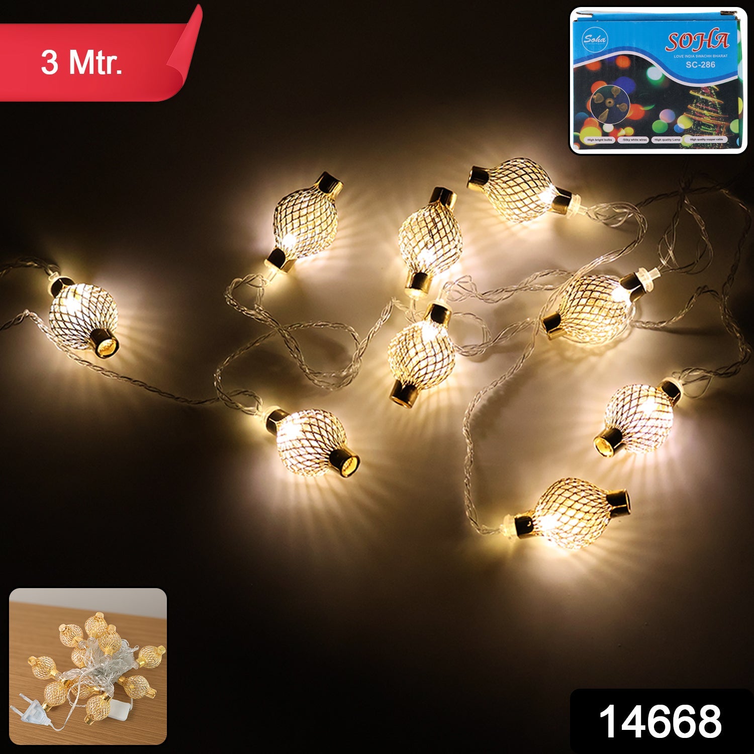 Close-up of decorative golden metal ball LED string light on plug-in wire