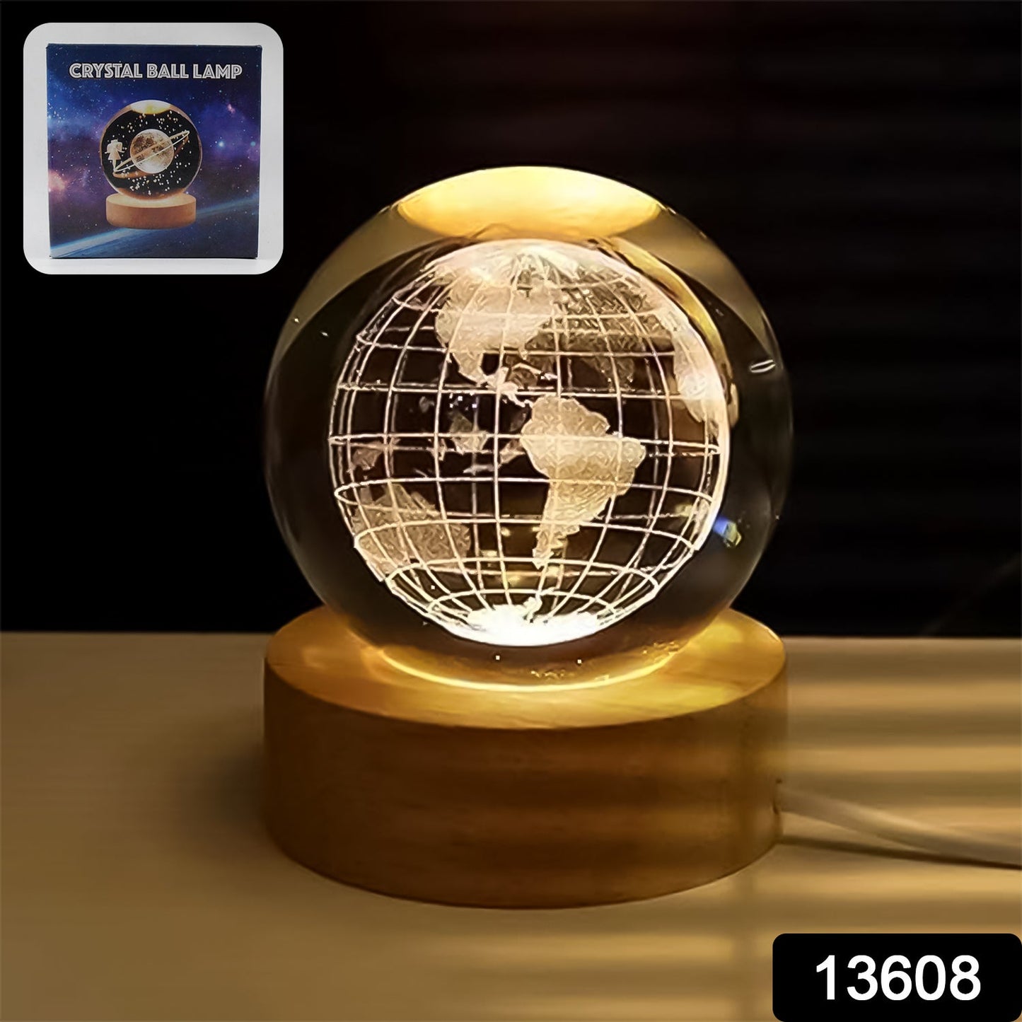 Close-up of the illuminated 3D crystal ball lamp showing intricate world map details.