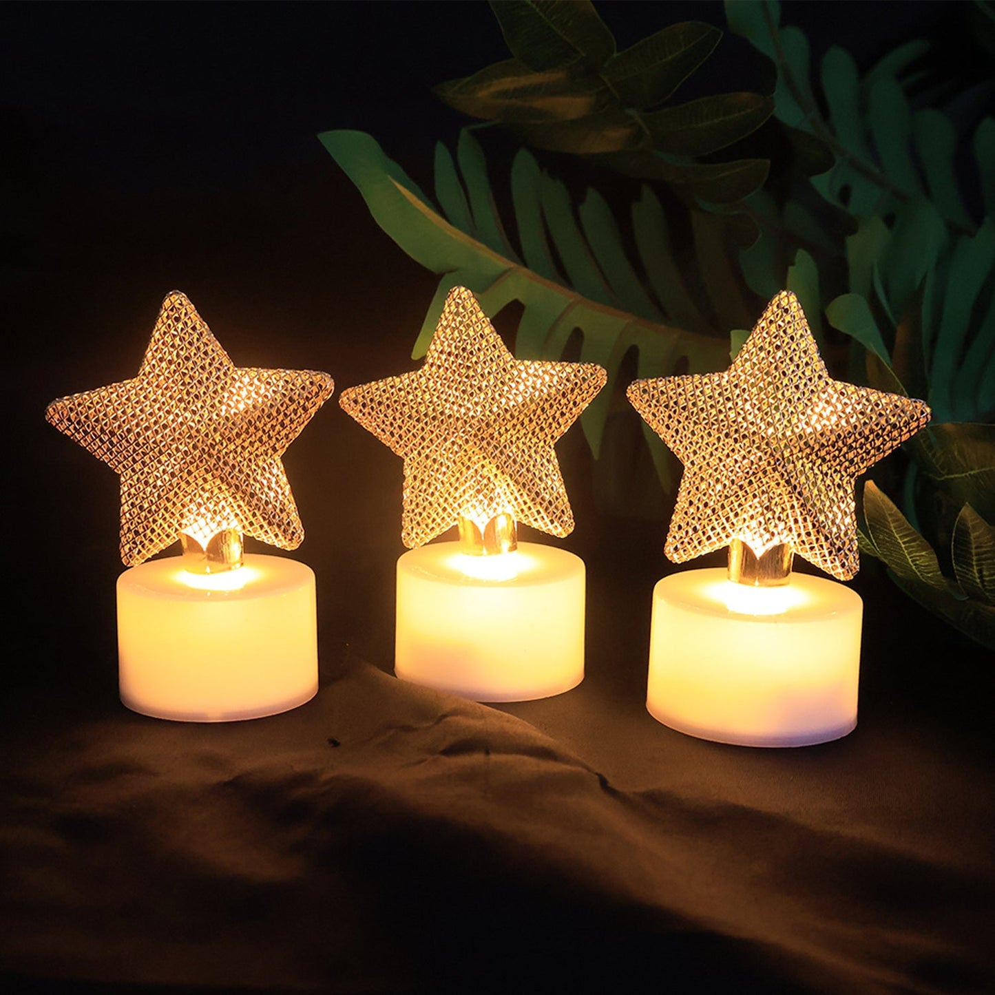 LED star candle decorative set illuminating indoor party space