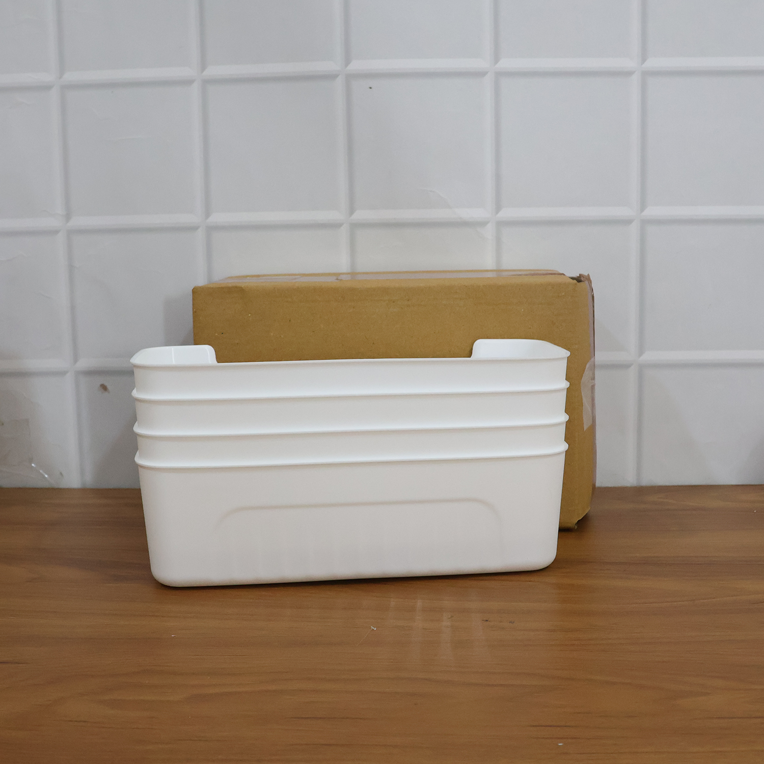 White plastic storage baskets displayed for home organization